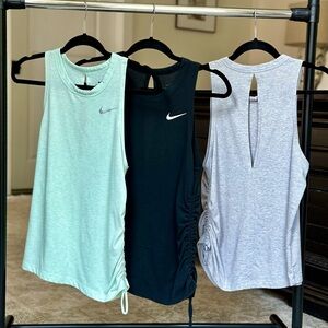 (3) Women’s Nike Open Back Tanks with adjustable ruched side. Size Small.
